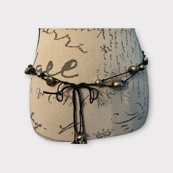 Boho belt,2 black cords tied with pewter stones of various sizes. Ties to close - Picture 2 of 7